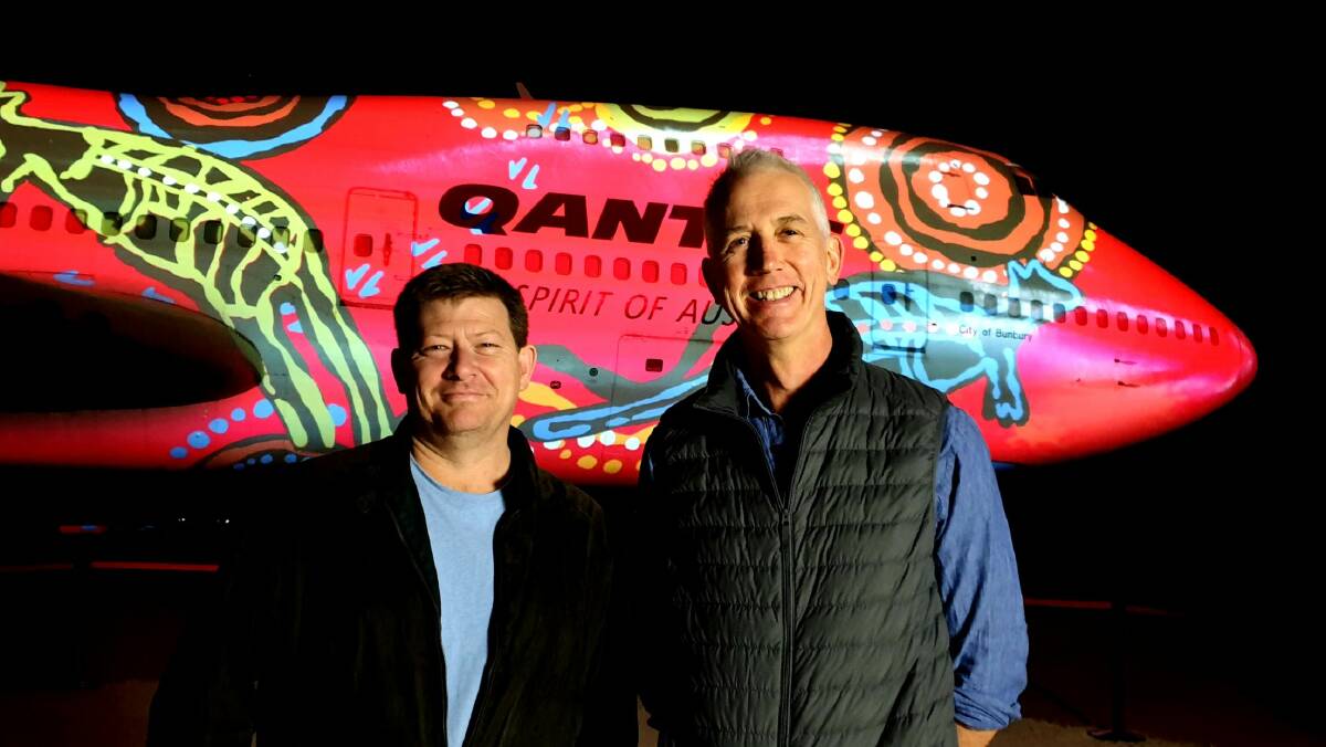 LIGHTING UP THE SKY: Buchan senior associate Anthony Rawson (left) with Qantas Founders Museum CEO Tony Martin.
