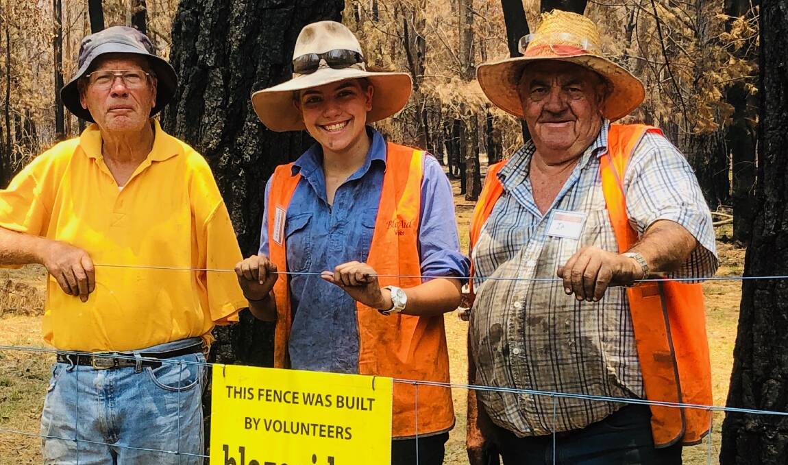 GENERATIONS: BlazeAid volunteers Tom, Charlotte (14) and her grandfather Ian at the Ebor in camp in NSW. Photo: Ken Guymer