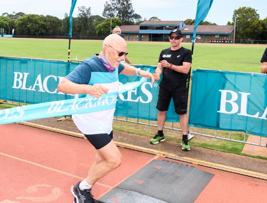 Ray 'Eagle' James, 71, crosses the finish line.