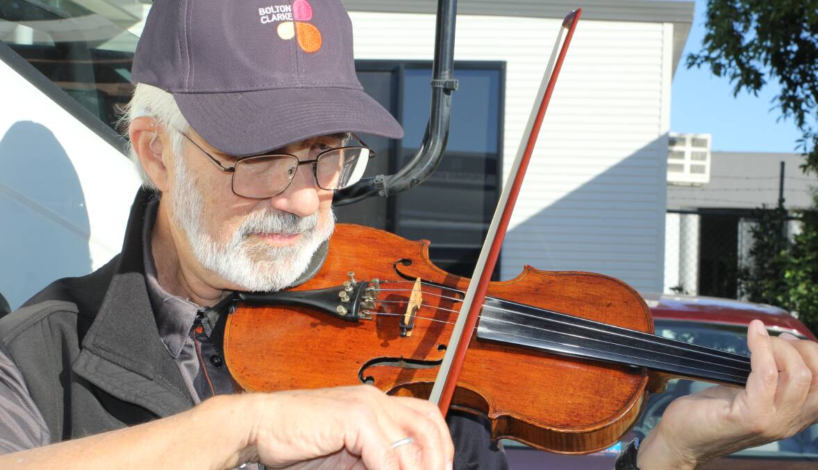 MOVING RECITALS: Hungarian-born classically trained violinist and delivery driver Kornel Banvolgyi brings food and music to residents at Bolton Clarke aged care facilities.