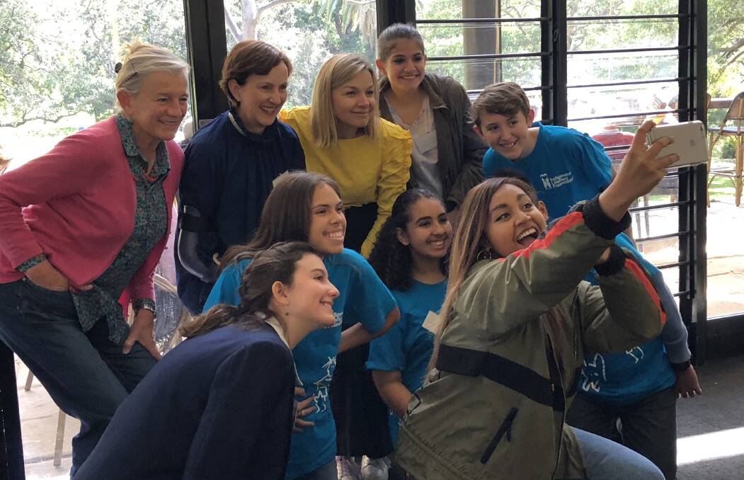 SAY CHEESE: (back row from left) Alison Lester with International Literacy Foundation founder Suzy Wilson and ILF ambassador and actress Justine Clarke have a selfie taken with ILF ambassador - singer and actress Jessica Mauboy - and ILF representatives