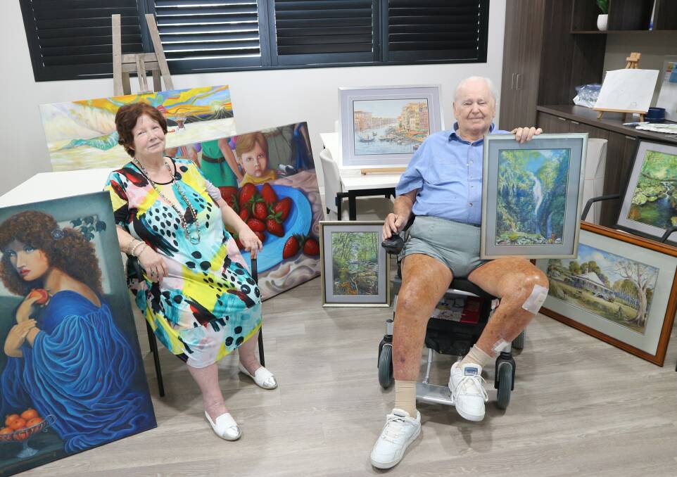 Dawn Crosbie and Bill Baker in the art studio at Arcare Springwood aged care facility.