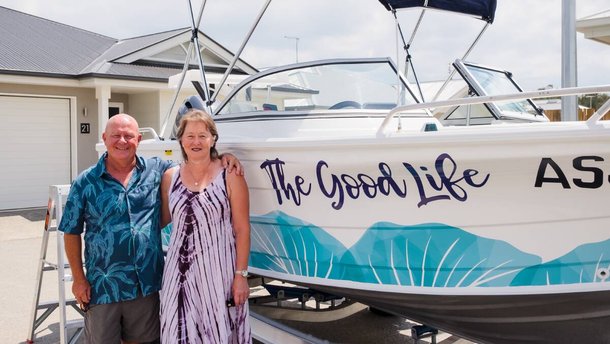 Ingenia Hervey Bay residents Rob and Jacqui Chappel with the community boat.