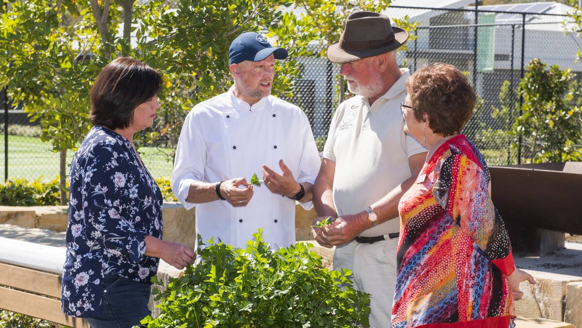 Celebrity chef Matt Golinski (second from left) and local farmer and founder of Kookaburra Organics Gary Hands at a paddock to plate workshop at Halycon Glades.