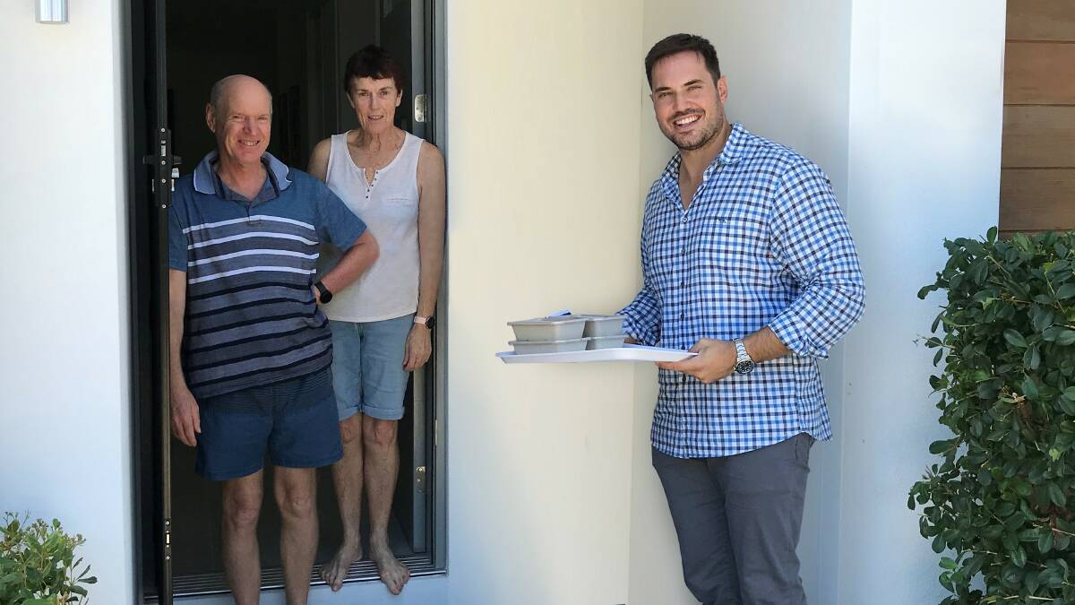 GemLife director and chief executive Adrian Puljich delivers free meals to residents at GemLife Bribie Island.