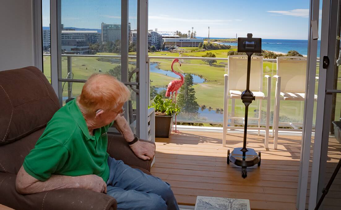 IRT Links Seaside retirement village resident David Robson with 'Bluey' the telepresence robot. 