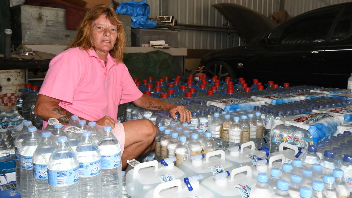 Maree Glohe with some of the water donated by people in Orange. Photo: Carla Freedman