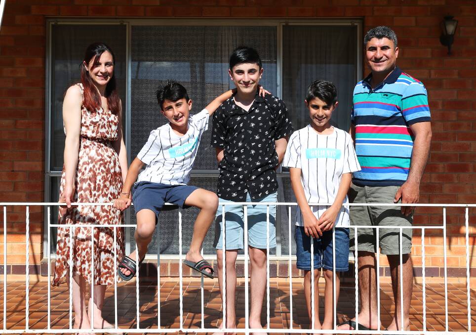 Zenah Shamo with family Randi, 9, Ronejan, 12, Redwan, 11, and Drei Darwesh are thrilled to be reunited in Wagga after four years apart. Photo: Emma Hillier 