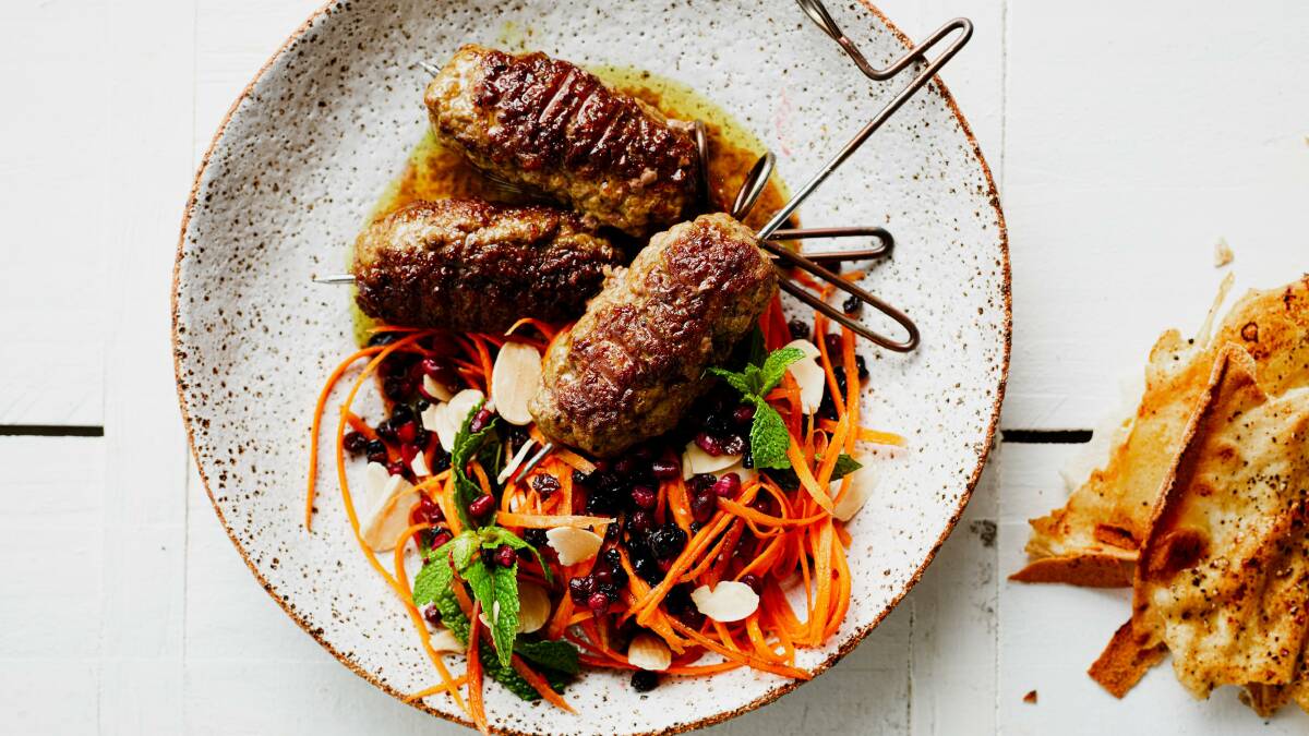 Lamb kofte with minted carrot salad and lightly-spiced flatbread. Picture: Supplied