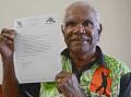 ARTWORK: Aboriginal leader Charlie Jackson displays the group's letterhead which features indigenous artwork.