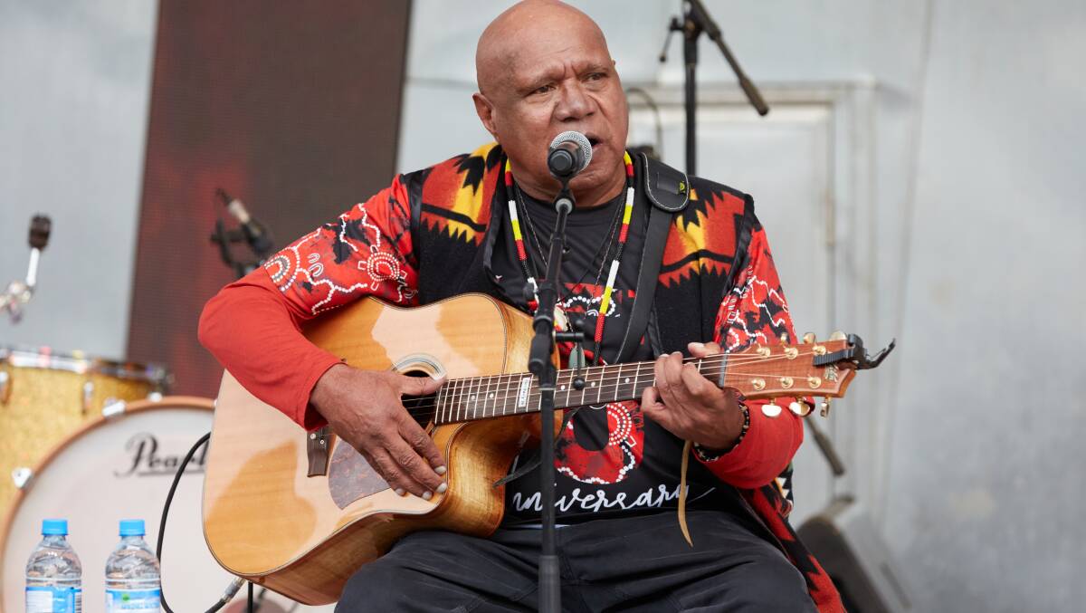 Archie Roach performs during the Long Walk celebrations before the Dreamtime at the 'G clash between Essendon and Richmond in Melbourne, 2019. Photo: AAP Image/Erik Anderson