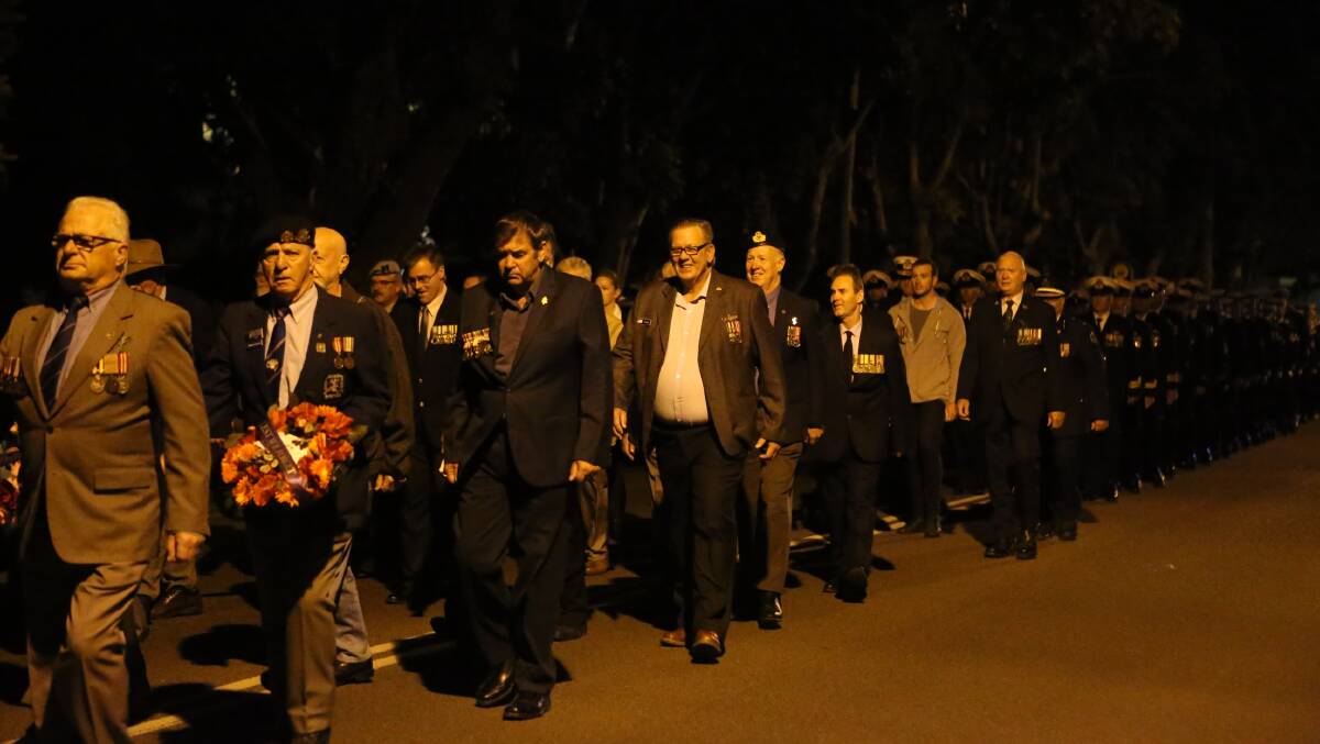 Veterans march at the Greenwell Piont Anzac Day dawn service.
