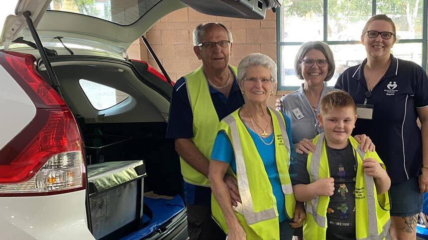 HELPING HAND: Lismore Meals on Wheels' flood response was a family matter for John and Terri Hewett, Paula Whitehead, Leo Scott and Sophie Hewett (pictured left to right). 