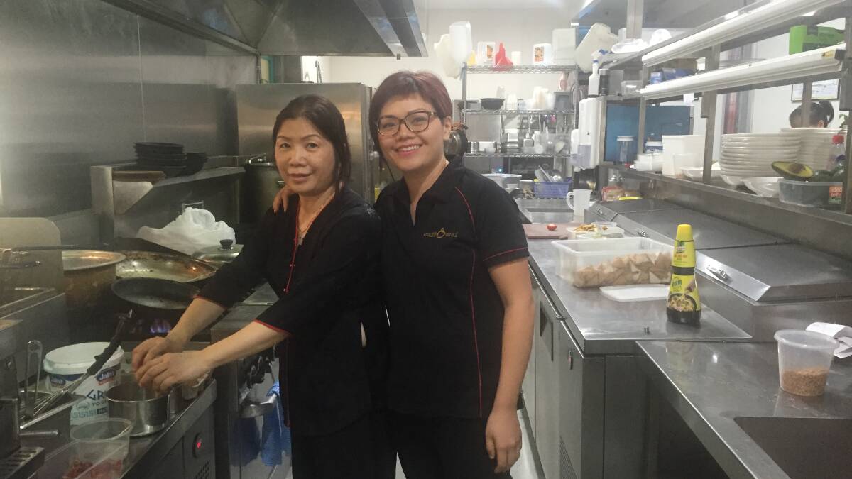 FOOD OF LOVE: Kim (left) and Maggie Nguyen in the kitchen of their family restaurant Cafe O'Mai. 