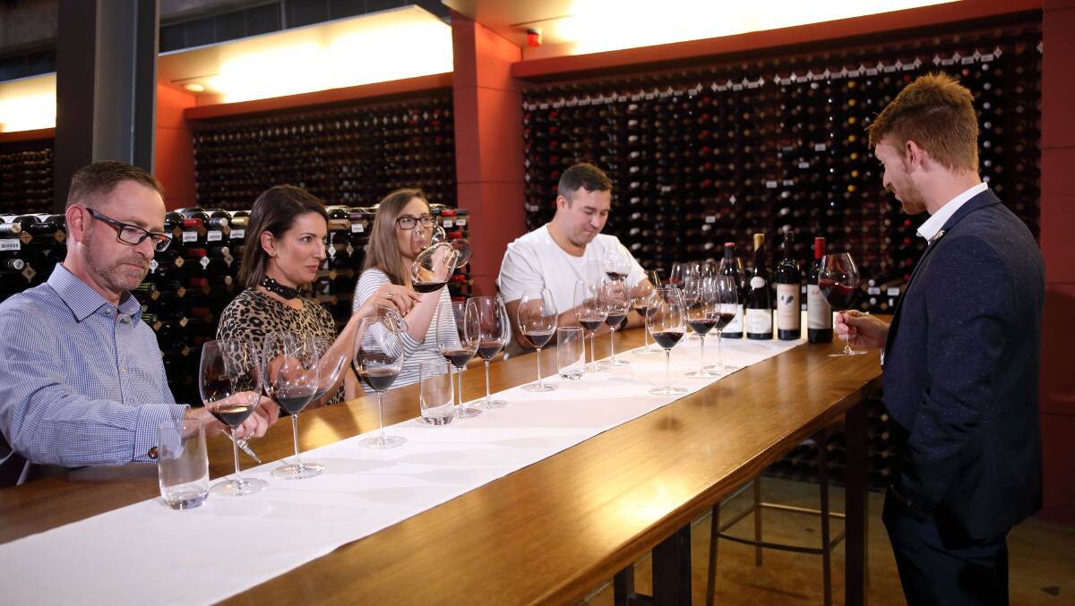 GLASS IN SESSION: Master classes in the impressive open cellar are among the new tour experiences offered by the National Wine Centre of Australia. 