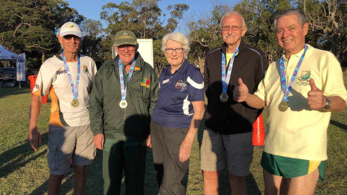RUNNING MATES: Bankstown Sports Athletics fielded the first 80 plus relay team in NSW this May. Pictured: (l-r) team members Tony Re, Alan Atkins, Roger Hillsdon and Abdon Ulloa with Athletics NSW official Jann Gibb (centre.)