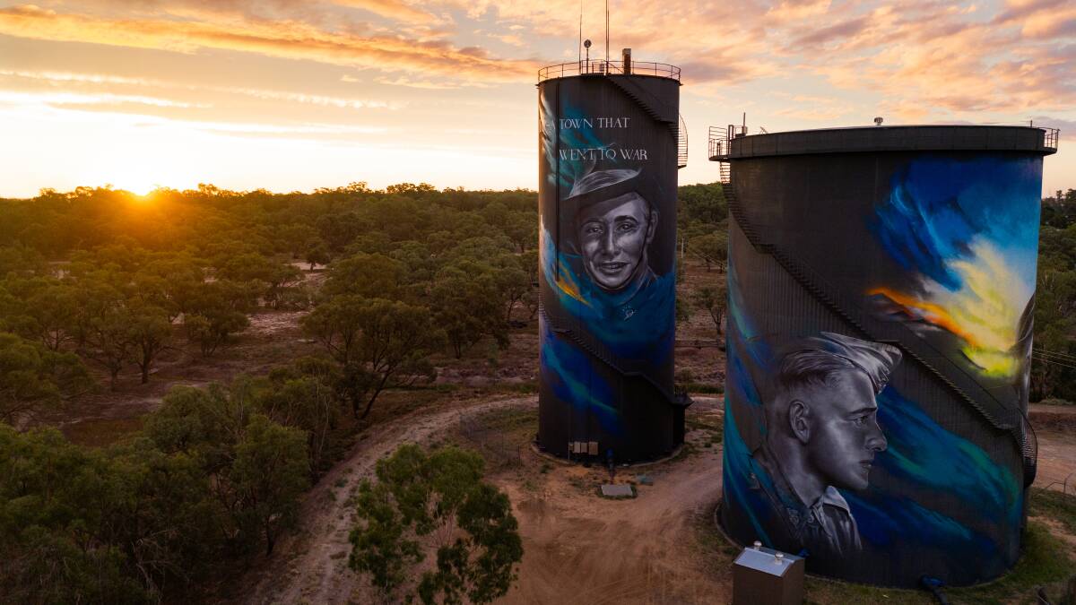 HIGH HONOUR: New artworks on Hay's water towers which pay tribute to local World War II veterans are the latest additions to the Australian Silo Art Trail. Photo: Rachel Lenenhan