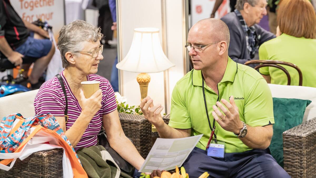 LIVEING IT UP: Sean Watt from the Bethanie aged care group (right) talks to a visitor at the Perth Care & Ageing Well Expo.