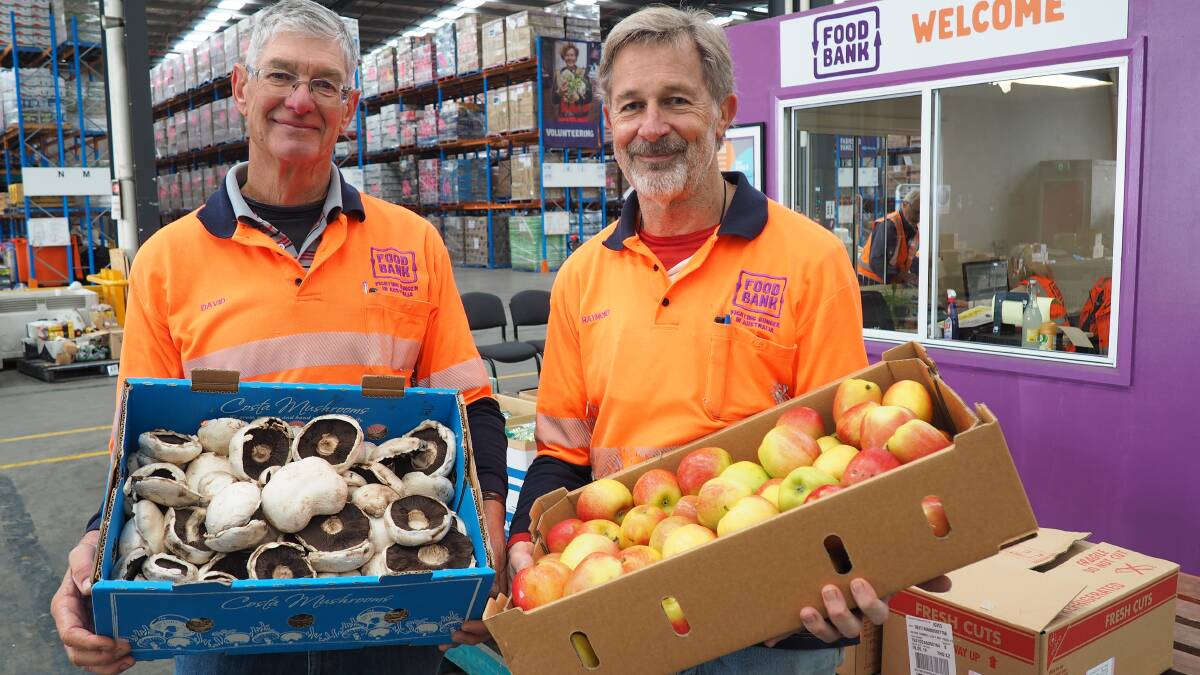 INVEST SOME TIME: Foodbank Victoria is seeking volunteers to help a number of its charity partners. Pictured:(l-r) Volunteers David and Raymond.
