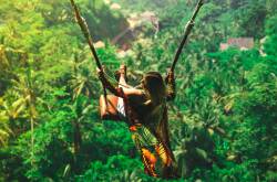 Visitors now have to pay atax to visit popular Bali attractions like Ubud's Bali Swing. Should Australia follow suit? Photo by Christopher Alvarenga courtesy of Unsplash