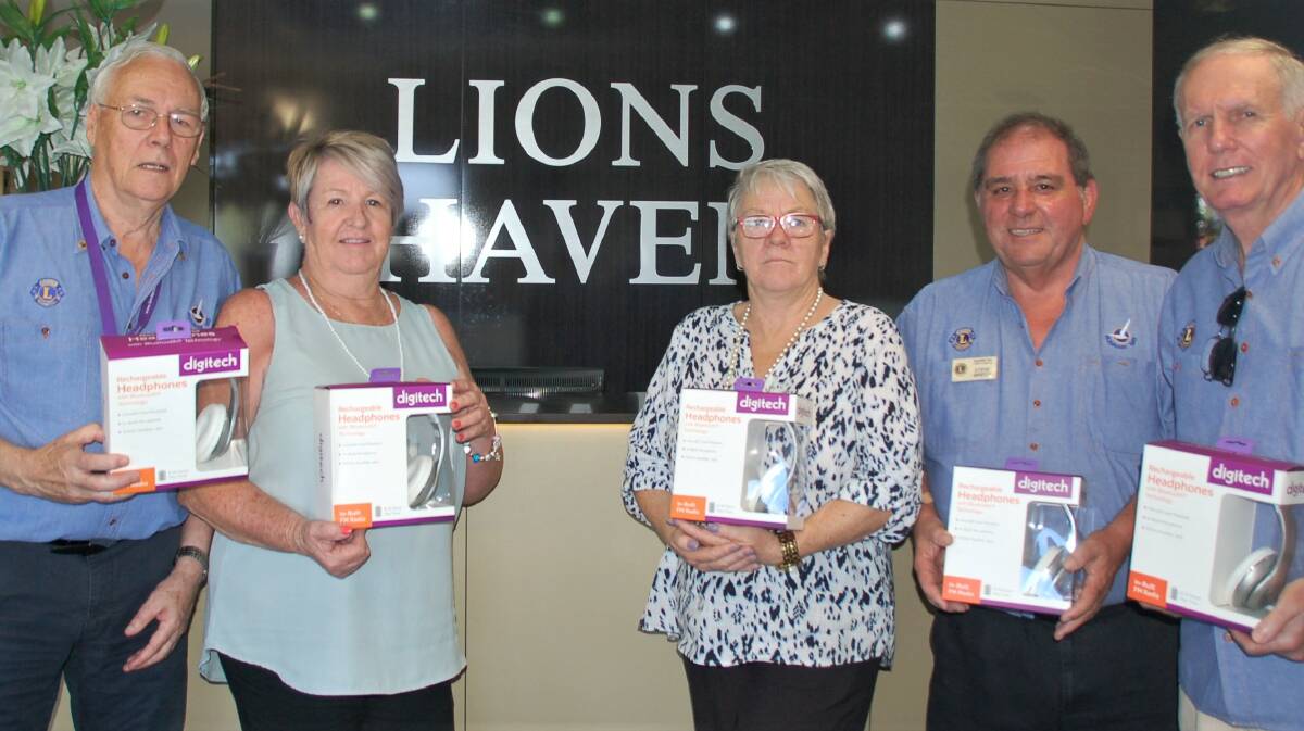 Runaway Bay Lions Max Tunnicliffe, Steve Grech and Graham Wythes present the Music for Dementia equipment to Colleen Dix and Rena Newman at Lions Haven for the Aged