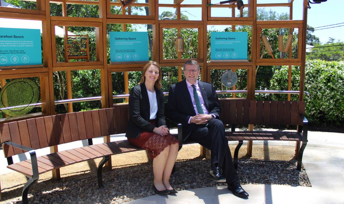 MAKES SENSE: The new sensory garden at Dementia Australia's North Ryde office features areas with different textures that can be touched and felt. Pictured: Dementia Australia executive director of client services Susan McCarthy and Ambassador John Watkins.