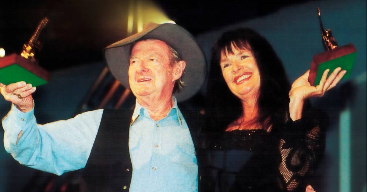 GOLDEN MOMENTS: Slim Dusty and Norma O'Hara Murphy celebrate their Golden Guitar win in 2001 for the hit song Paddy William. Photo: June Underwood, Tamworth