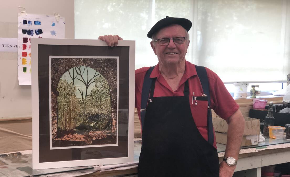 PICTURE PERFECT: Raymond Atkins believes it's never too late to start following a dream. Pictured with one of his artworks. 