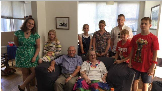 FAMILY TIES: Wendy Pfeifer and husband Bob (seated) with seven of their grandchildren.
