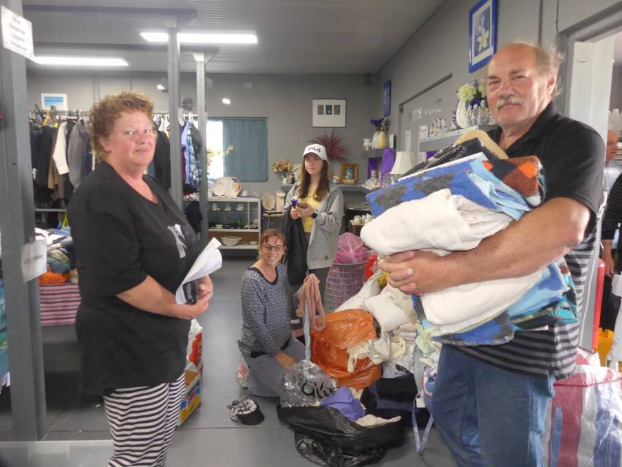 Kangaroo Island locals Jan and Max Radnell at Island Care on Sunday picking up linen items to make wildlife rescue pouches.