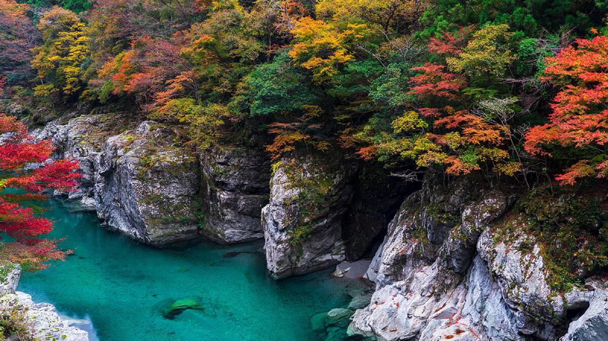 Iya Valley in autumn when the leaves are turning and the water is tranquil. Picture: JNTO