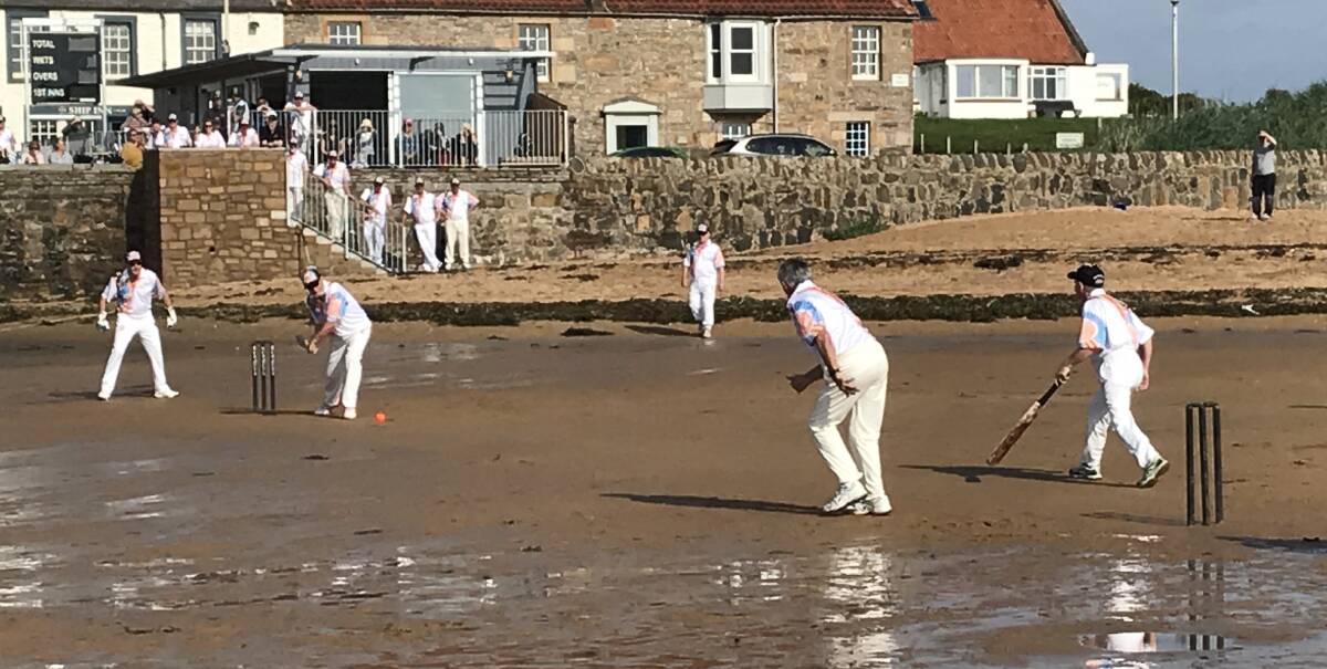 BUCKET LIST: Victorians play on the hallowed sand at Elie Beach in Scotland, home of the Ship Inn pub XI, during the veterans tour of the UK last year. It wasn't clear who won but the tide did appear to be turning.