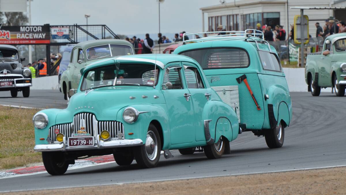 Hitting the road: Neville Maver's FX ute with its camper made from an FJ Holden ute takes to the track during Historic Winton.