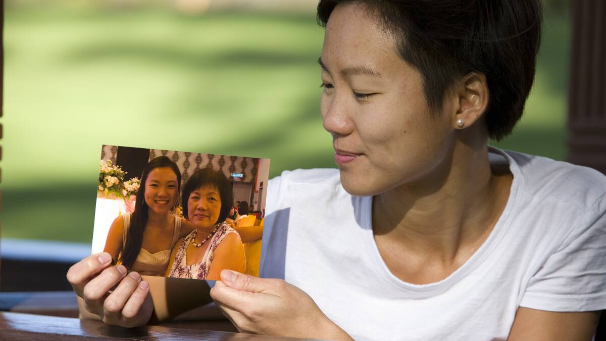 NO MORE, PLEASE: "The reason I get out of bed every day is I don't want this to happen to someone else's mum," says Belinda Teh, looking at a photo of her mother in happier times.