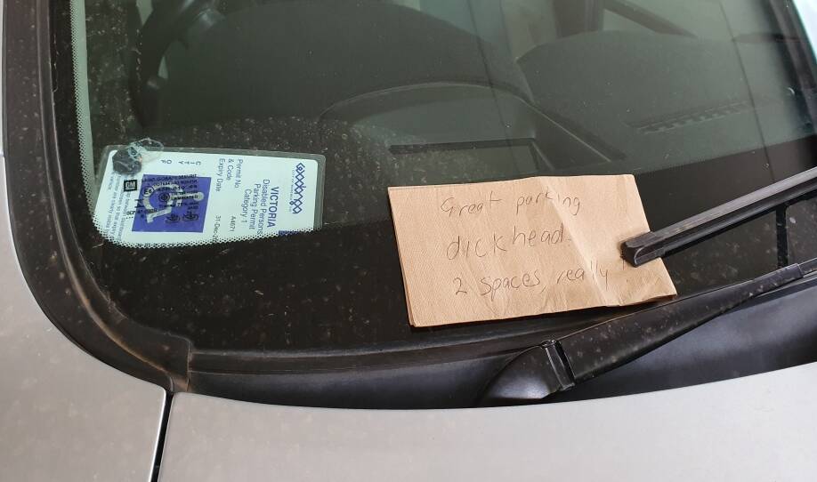 A makeshift note said 'great parking d******d. 2 spaces really!'