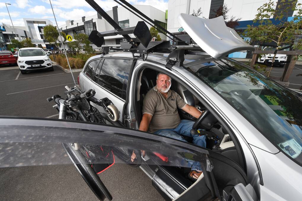 FRUSTRATED: With no disabled car parks, Wodonga resident Grant Myers did his best to accommodate for his wheelchair hoist in the Woolworths car park. Picture: MARK JESSER