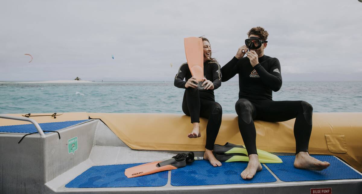 GOING OVERBOARD: Snorkel, flippers and into the water on an Ocean Safari adventure into the deep.