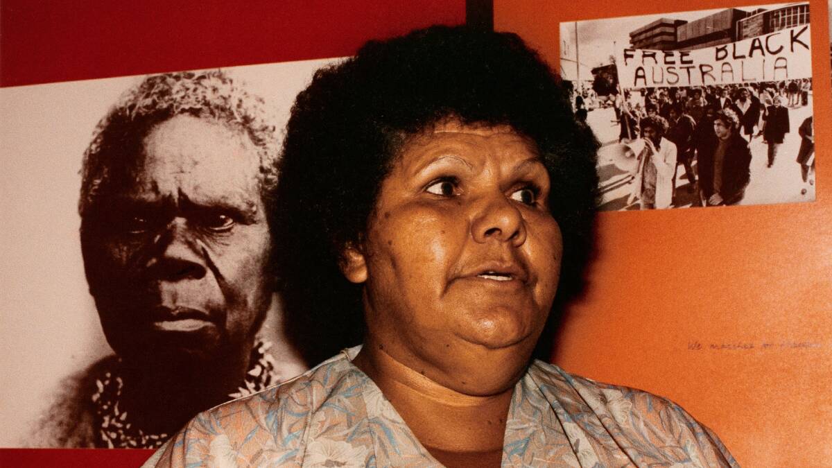 INDOMITABALE SPIRIT: The late Mum Shirl in 1984 with an image of Truganini, the so-called "last of the Tasmanian Aborigines", in the background. Photo: Elaine Pelot Syron 