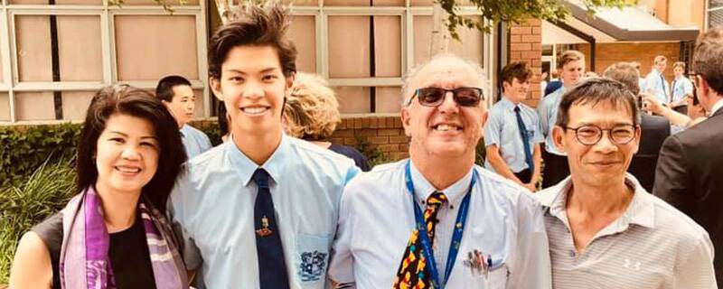 CLASS ACT: Brian with 2022 Marist College captain Andre Li and his parents. Andre and his Year 12 schoolmates were among many who helped Brian raise funds for the Children's Tumour Foundation. 