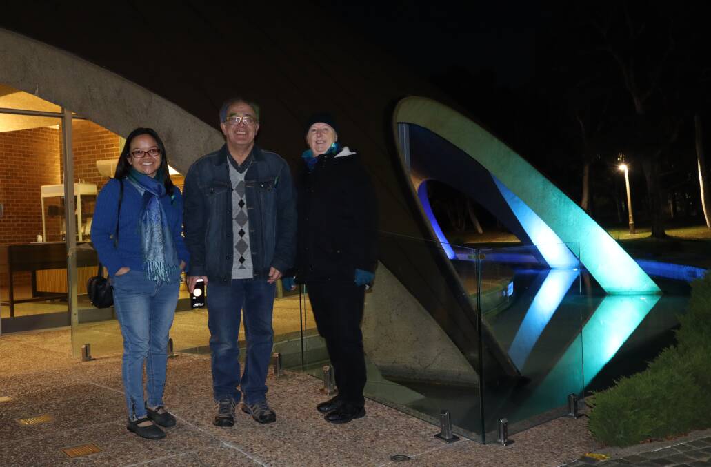 RUGGED UP: Brian Shaw, Jacqui Doung and Sandra Shaw outside the "Shine Dome" (Australian Academy of Science), one of many buildings that lit up around Australia in colour to promote World NF1 Day and World NF2 Awareness Day in May. 