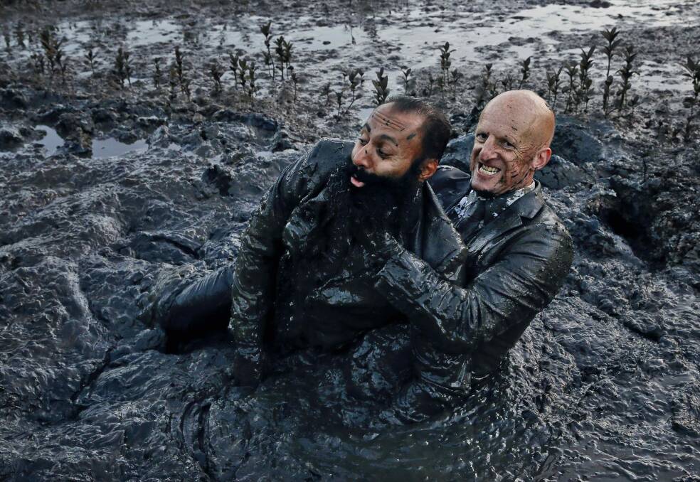 DOWN AND DIRTY: "This" by David Wood brings together 30 collaborators in a performance at The Substation in Newport that debunks pomp and power. Mud wrestling is a feature. 