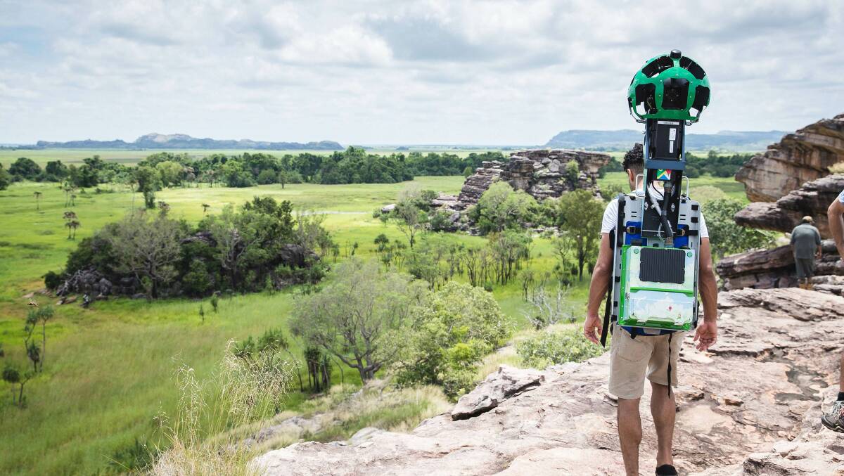 WIDE BLUE YONDER: A Google "Trekker" bearing a specially designed, camera-equipped backpack takes in the view from Ubirr Lookout on Kakadu Escarpment. The 15 5-megapixel cameras shoot constantly.
