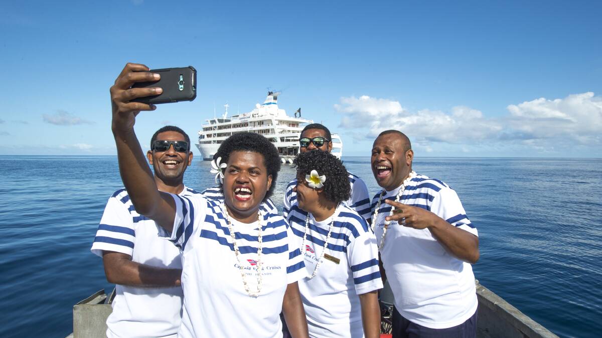 FUN BUNCH: Captain Cook Cruises is renowned for its crew members' friendly, effervescent personalities.