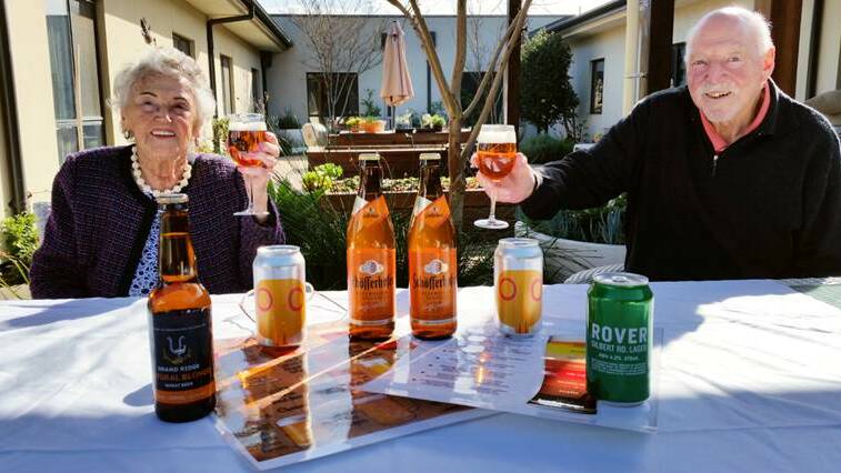 REFRESHING DROP: Peggy Gascoigne, 97, and Robert Lazarus, 81, raise a toast to the amber fluid at Arcare Port Lonsdale, where they are members of the Brewer's Table beer appreciation group, which meets every Thursday.