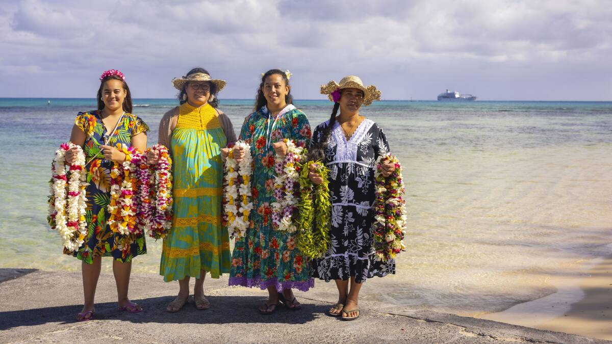 Tubuai islanders greet passengers from Aranui 5 with flowers. Picture by Lionel Gouverneur