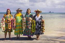 Tubuai islanders greet passengers from Aranui 5 with flowers. Picture by Lionel Gouverneur