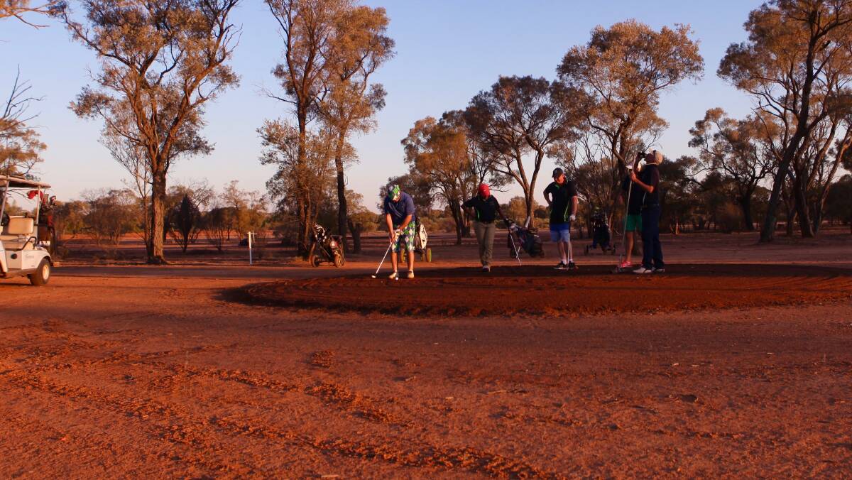 STUDY IN OCHRE: Quilpie Golf Club in the Queensland outback is known not so much for its greens as its reds, which have a beauty all their own.