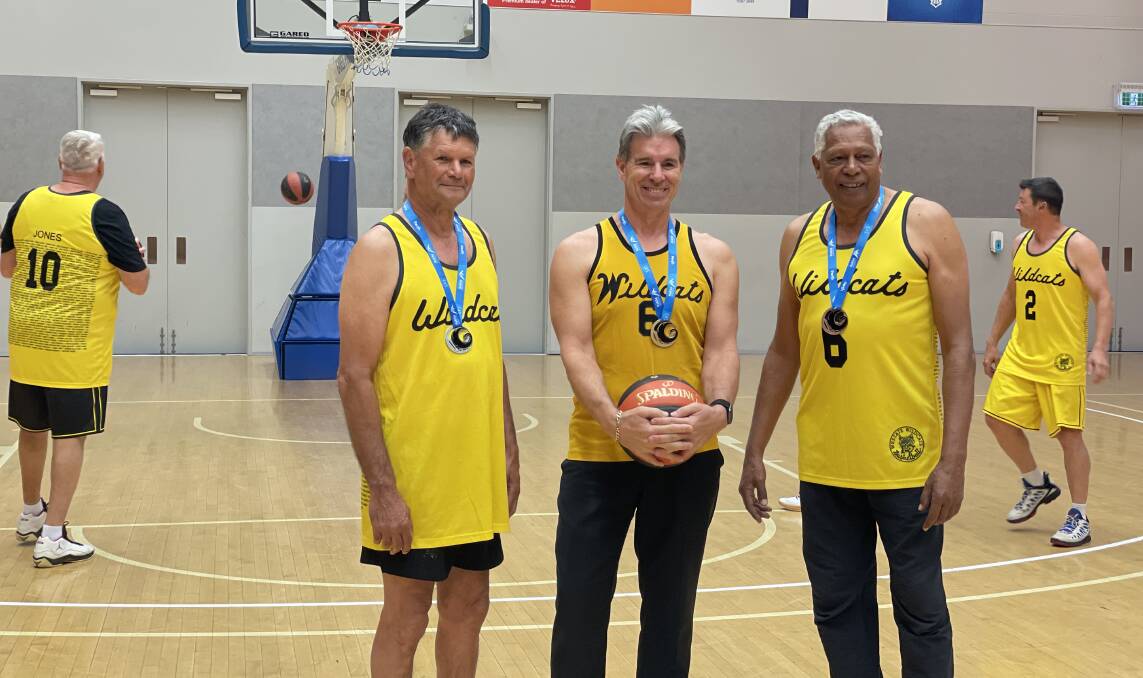 ONCE MORE, WITH FEELING: Former Wildcats captain Mike Ellis with old basketball mates Richard Whalley (left) and Ernie Dingo. The three will be taking to the court during the Australian Masters Games.