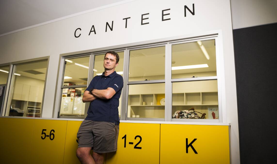 Tax policy specialist and volunteer Curtin Primary School canteen treasurer Ken Mansell outside the canteen. Picture: Dion Georgopoulos