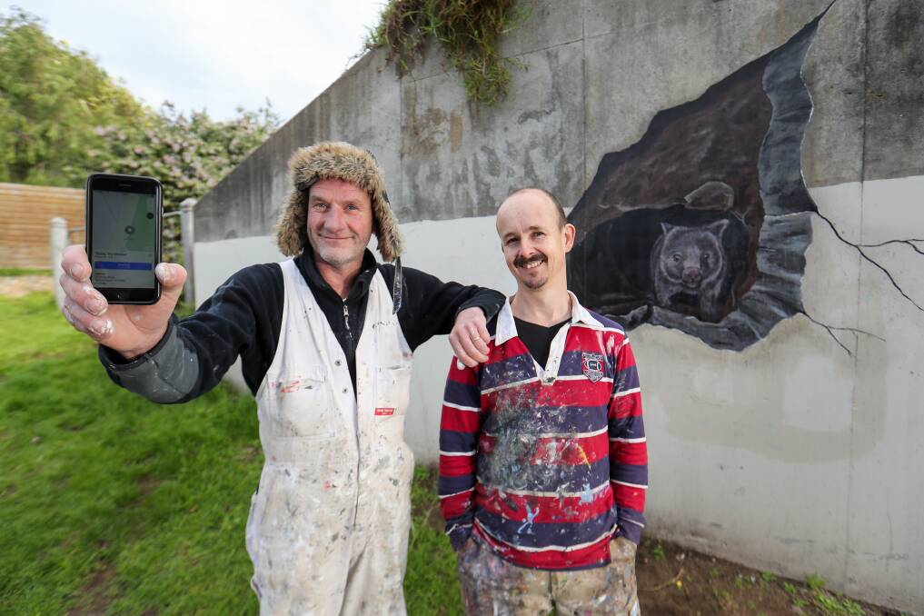 ON THE MAP: Phil Hoye and Jimmi Buscombe with Warrnambool's famous wombat Gutsy, who now appears on Google Maps. Picture: Morgan Hancock